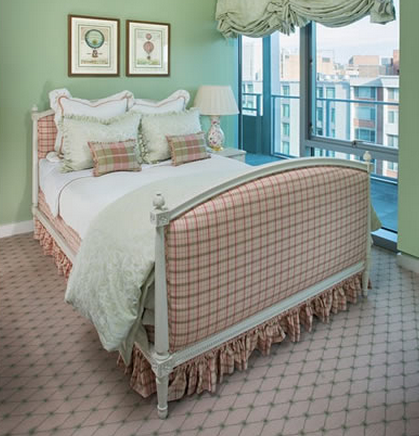 A pink-and-green plaid upholstered bed. Look by our interior designer Debbie Blair.