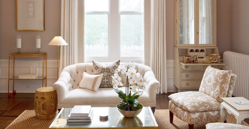 Beige, white and gray pillows on a white sofa. Room by Diane Litz.